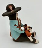 Sitting Nataani Storyteller with Kids by Irwin Pecos